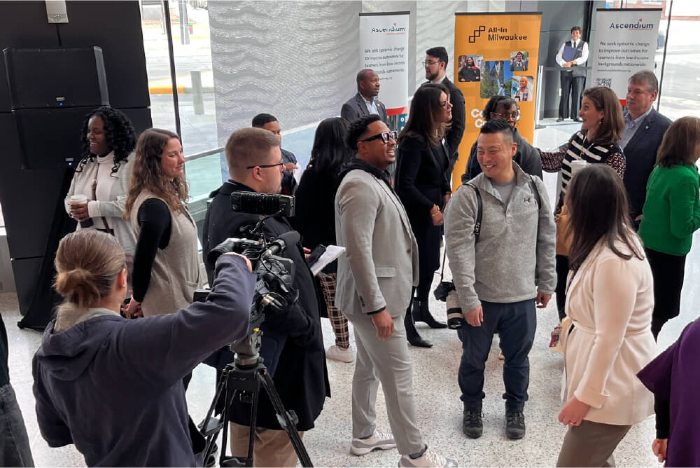 Press and community members gather at a Milwaukee event hosted by Ascendium and All-In Milwaukee.