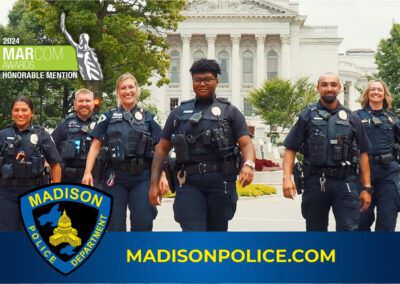 Madison Police Department officers walk together in front of the Wisconsin State Capitol as part of a video recruitment campaign produced in Madison, WI.